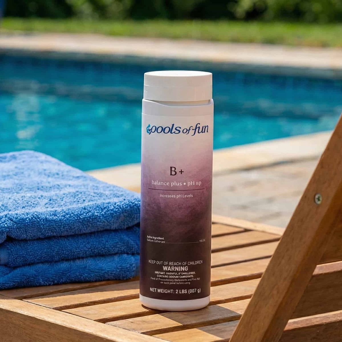 'Pools of Fun' pool product on a wooden deck by a pool.