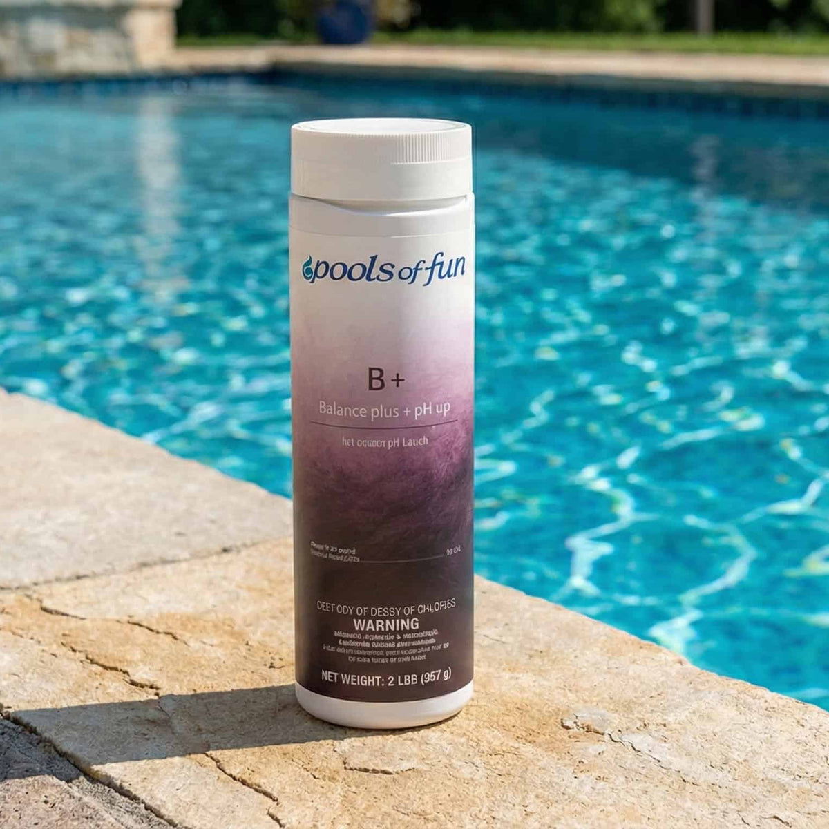 Bottle of pool chemical by 'Pools of Fun' on a poolside ledge with a pool in the background.
