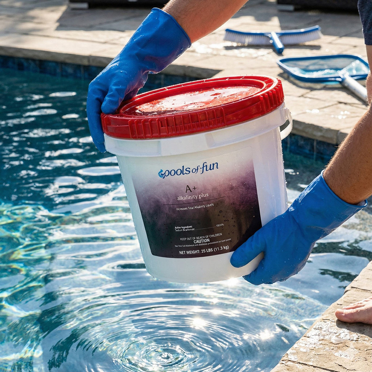 bucket labeled 'Pools of Fun' by a pool, with blue gloves on.