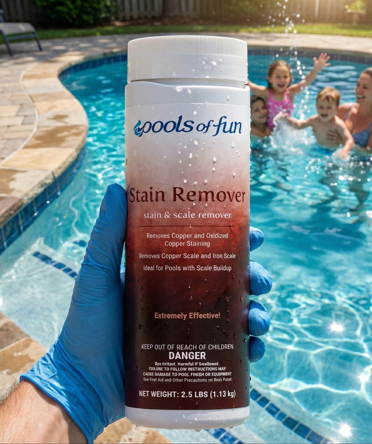 Bottle of 'Pools of Fun' Stain Remover held by a gloved hand with a pool