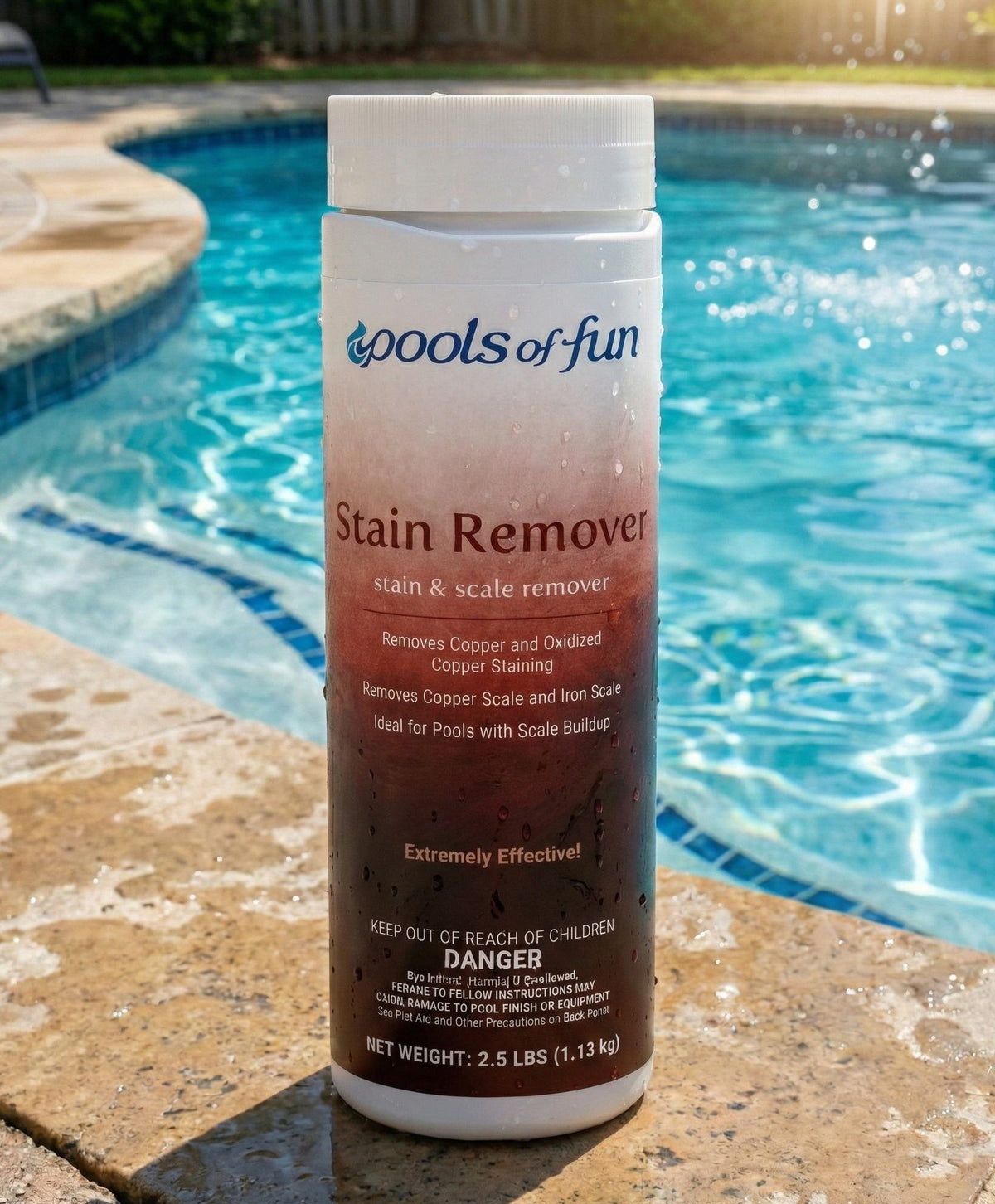 Pump bottle of 'Pools of Fun' Stain Remover by a pool