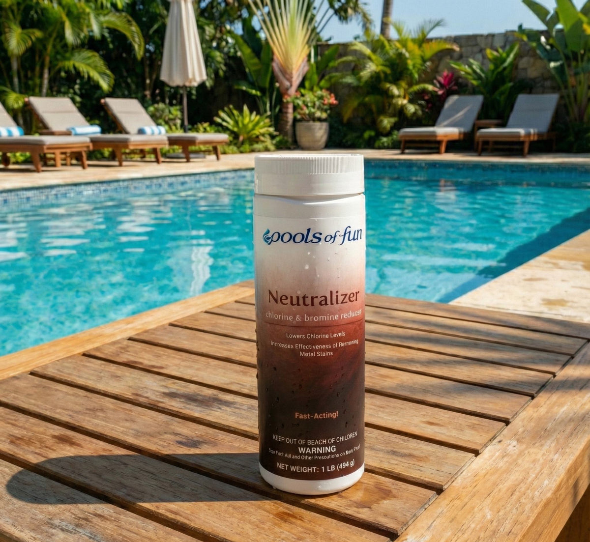 Pools of Fun Neutralizer bottle on a wooden deck by a pool with poolside furniture and plants in the background.