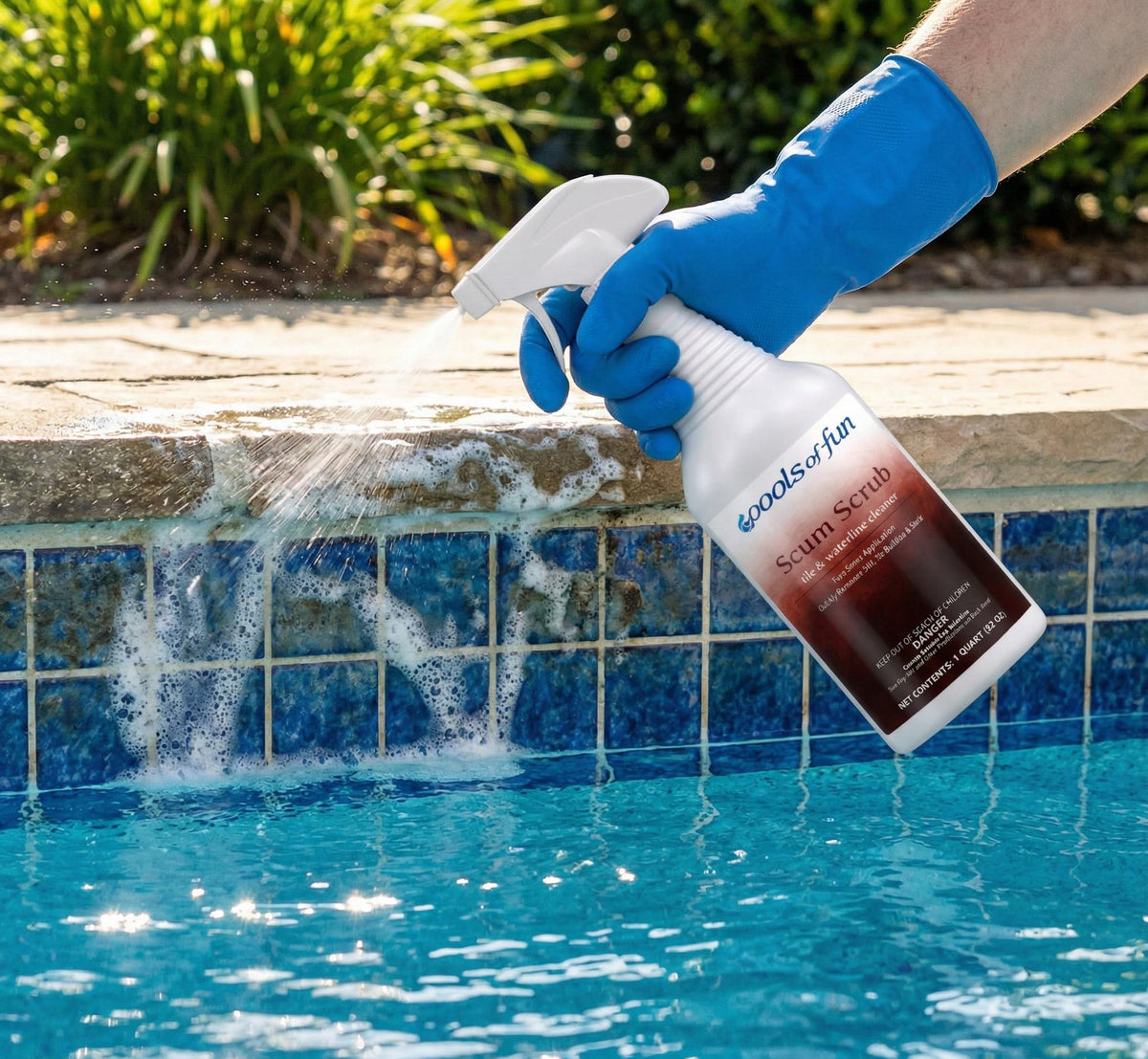 Person cleaning a pool with a bottle labeled 'Scum Scrub' by Woods of Hin.